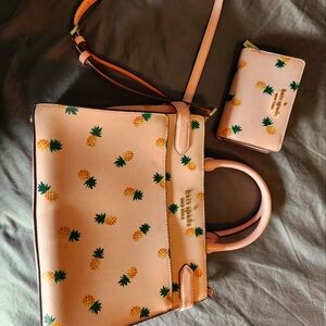 Pink pineapple Kate Spade purse and wallet